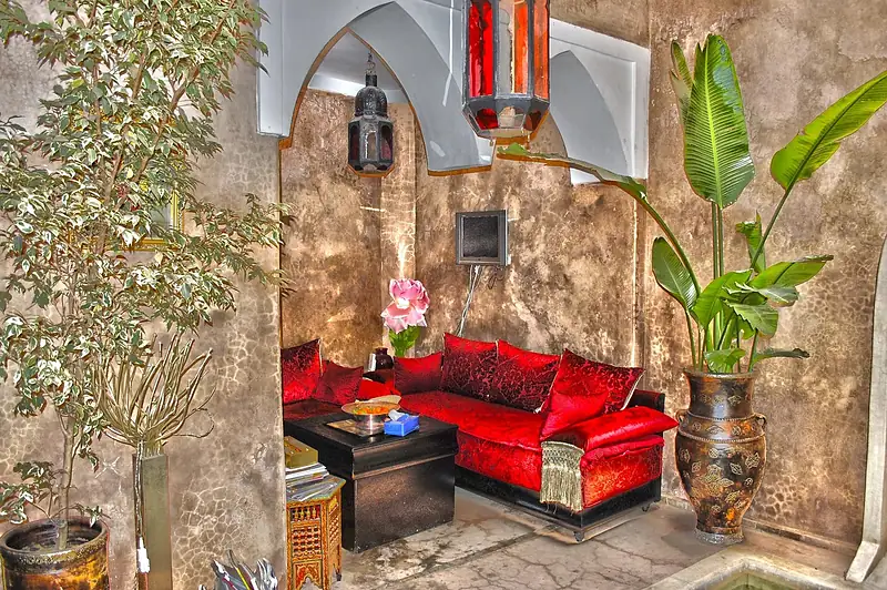 Colourful lounge corner in a Moroccan riad courtyard